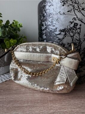 Coach Gold Sequin Wristlet with Decorative Bow and Chain